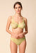 Model wearing Gossard Glossies Sunny Lime Sheer Thong Panty 6276 ATB with matching bra, highlighting coordinated lingerie set in vibrant lime.