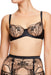 Dita Von Teese Julie's Roses Sheer Balconette Bra with embroidered rose detailing and satin straps, offering sculptural underwire support.