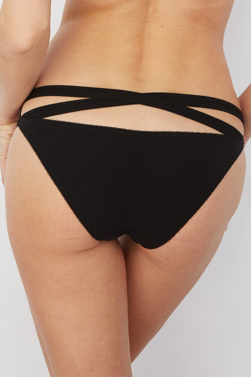 Strappy Bikini Panty Addiction Nouvelle Moulin in black with criss-cross back straps and soft microfiber fabric. Features sheer lace front and low-rise fit.