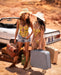 Two women in Sheer Mesh Babydoll Mapale Daisy Bliss posing with vintage suitcases and convertible, showcasing Lavinia Lingerie's playful and sexy style.