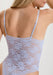 Back view of Lace Bodysuit in Lavender featuring sheer soft mesh and floral lace design. Elegant lingerie for comfort and confidence.