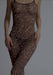 Dim-lit view of Mesh Maxi Dress Blush in leopard print emphasizing sheer stretch material and body-contouring design for nightwear fashion.