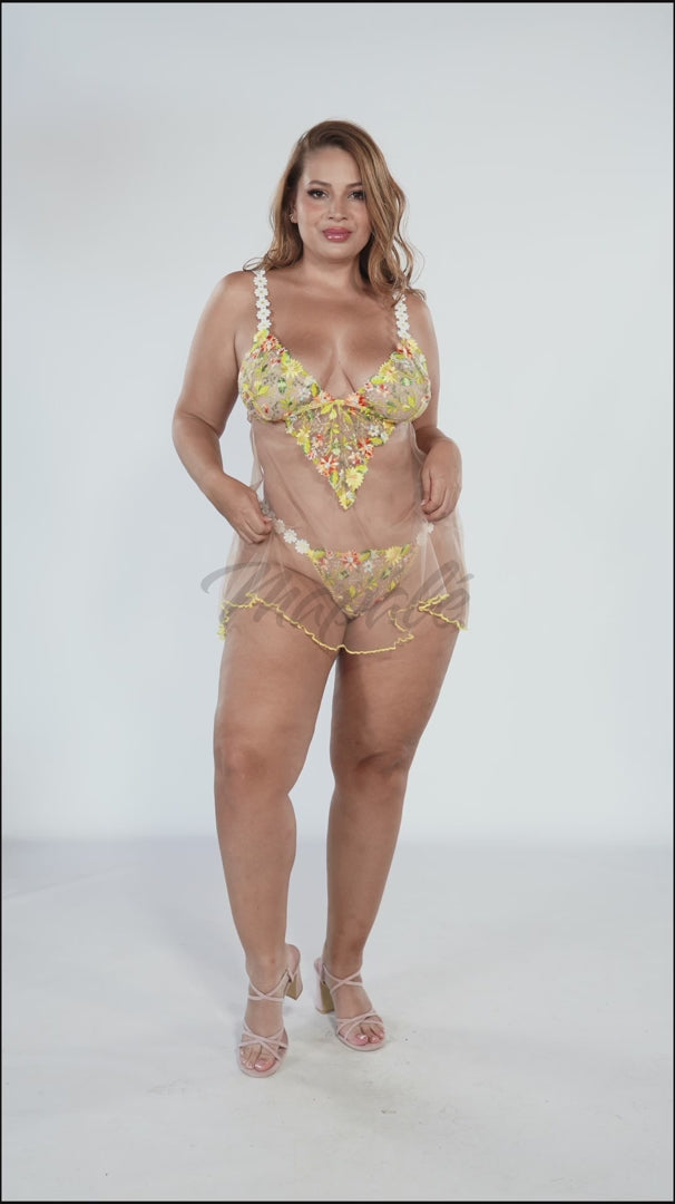 Sheer Mesh Babydoll Mapale Daisy Bliss in yellow with floral embroidery and ruffled hem, modeled in plus size. Available at Lavinia Lingerie.