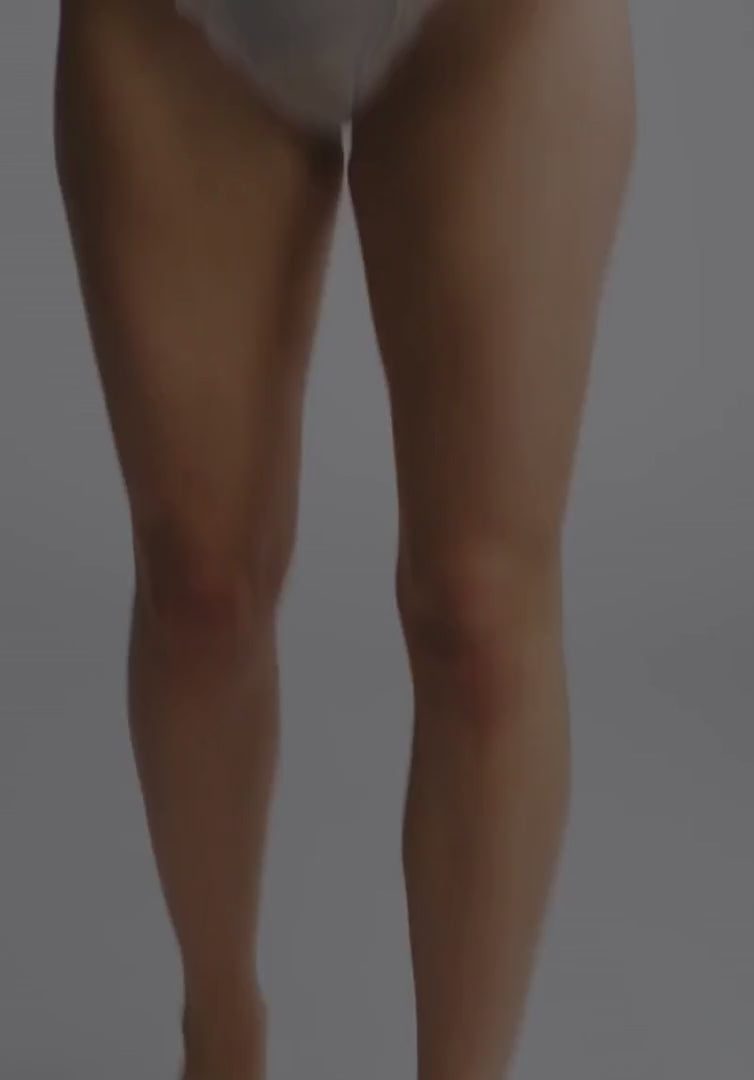 Motion shot of model wearing Sheer Lace Wireless Bralette – Lotus in Mint, highlighting the soft and flexible fit of the lingerie.