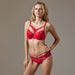 Full front view of model wearing Lauma Rouge Peek-A-Boo Bikini Panty and matching red bra, highlighting sexy and elegant lingerie set.