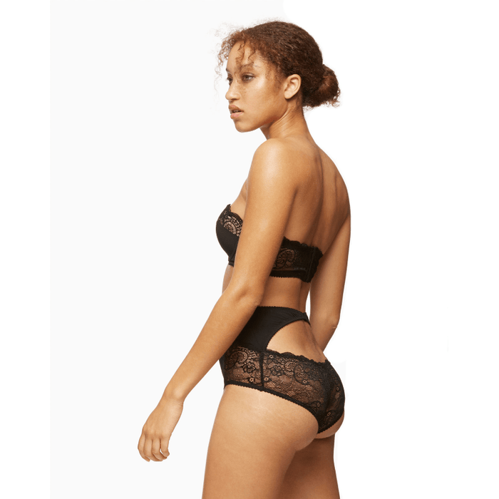 Side view of Blush Escape Longline Strapless Padded Lace Bra Black paired with lace panties, showing supportive band and lace detail.
