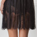 Detailed view of pleated lace skirt on Amoralle Eminent Nightdress, featuring sheer floral lace and hand-crafted elegance in luxury nightwear.